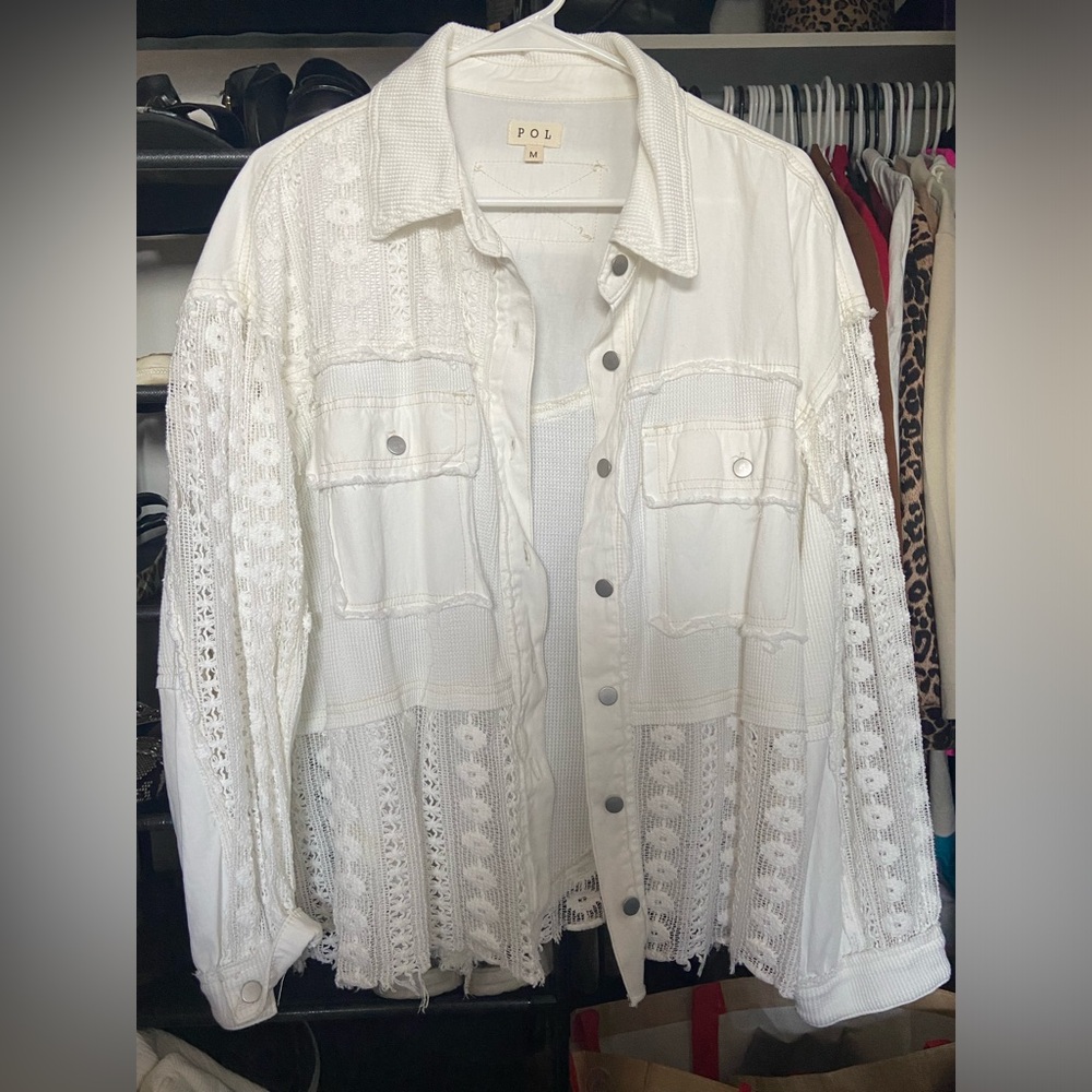 Relaxed fit. White. Lightweight. Medium can fit up to a XL.